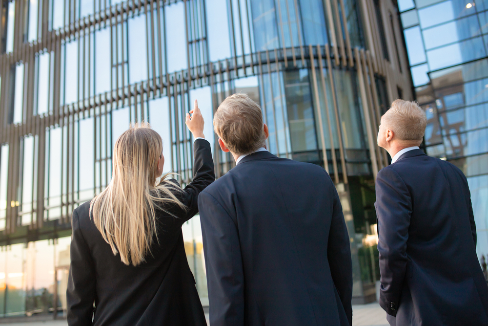 business professionals being shown their new office